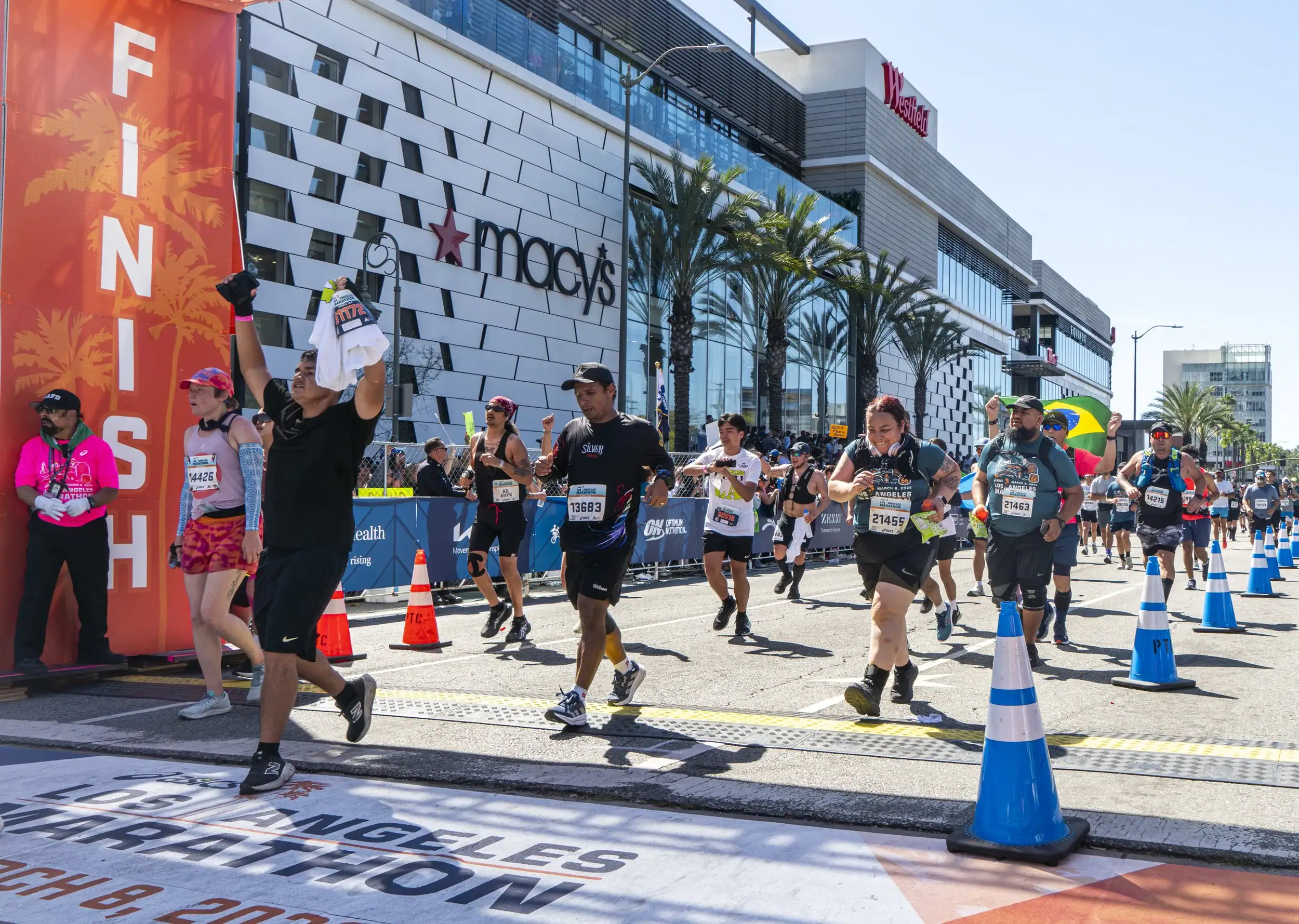 Runners crossing the finish line at the 2026 LA Marathon