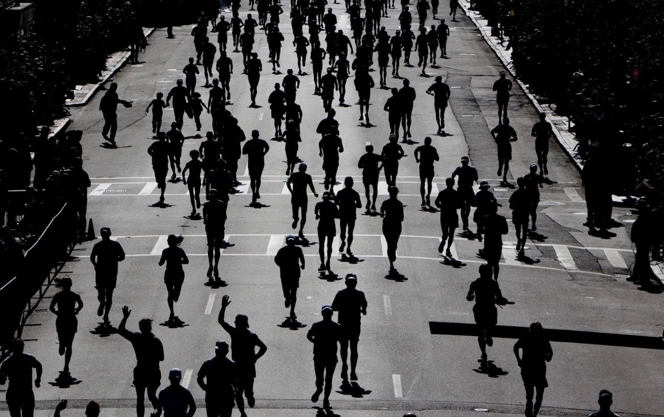 A black and white photo of marathon runners. 